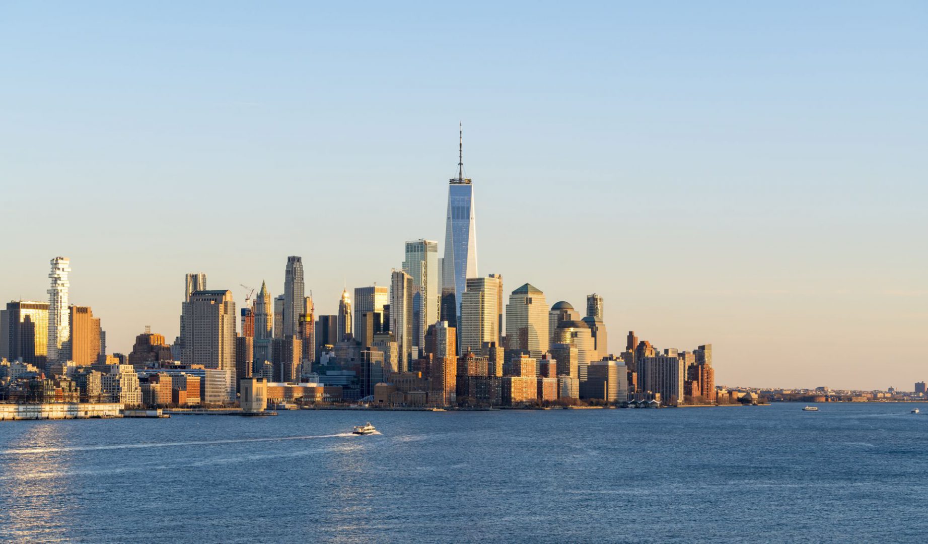 Beautiful scenic sunset evening view of lower manhattan, downtown of New York City, from Hoboken, New Jersey, over the Hudson river in USA. Famous attraction and iconic blue skyline view of america.
